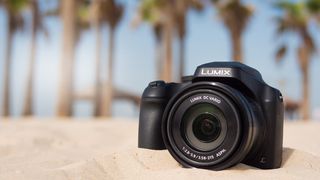 The Panasonic Lumix FZ80 / FZ82 camera on a sandy beach