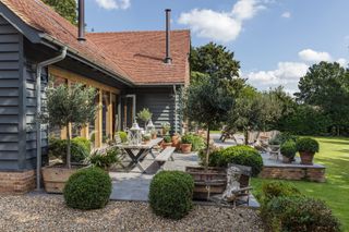 gravel pathway towards large patio area