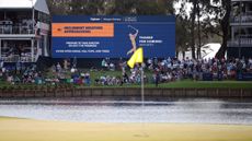 TPC Sawgrass with a sign warning of inclement weather in the forecast