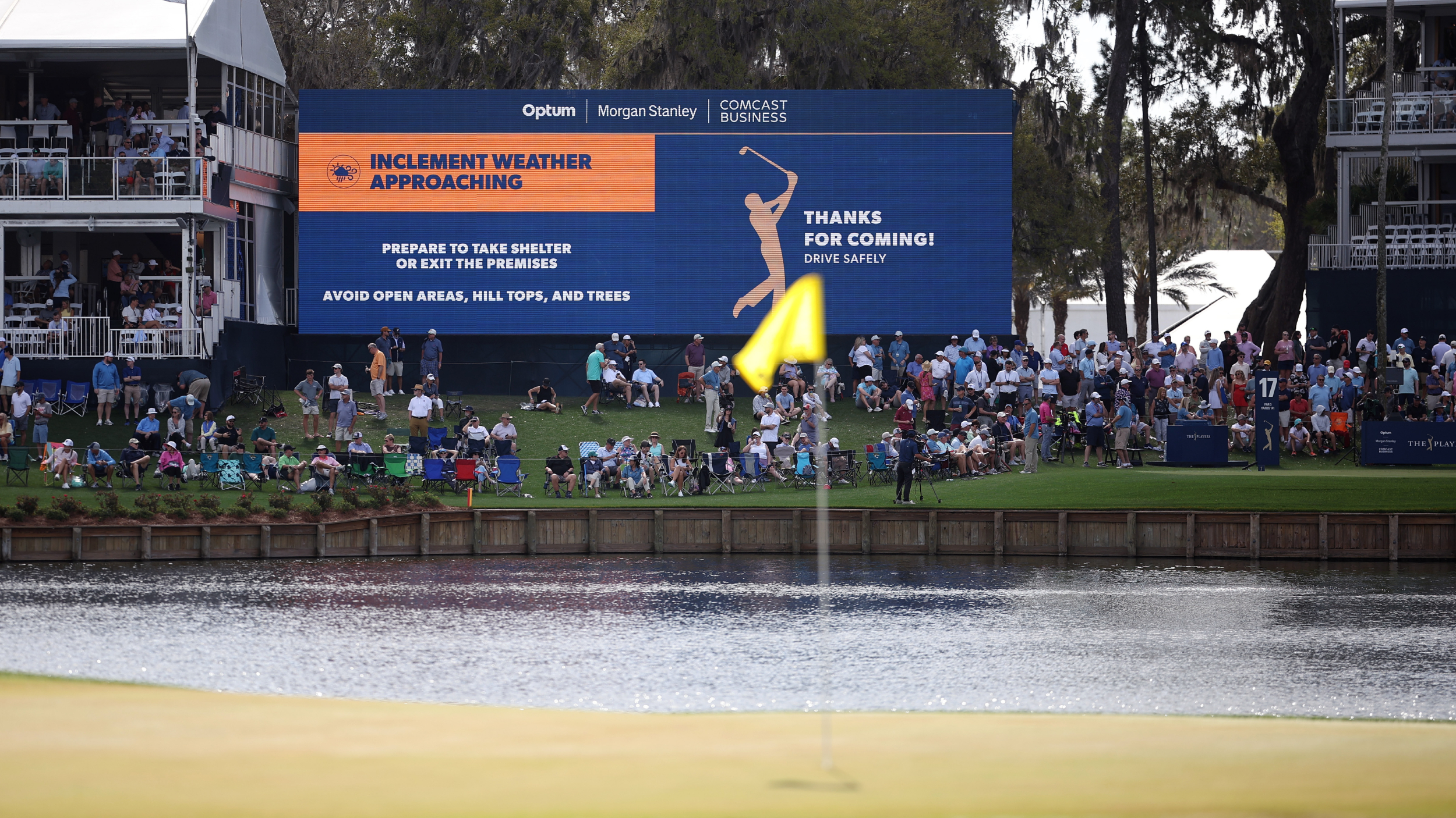 TPC Sawgrass with a sign warning of inclement weather in the forecast