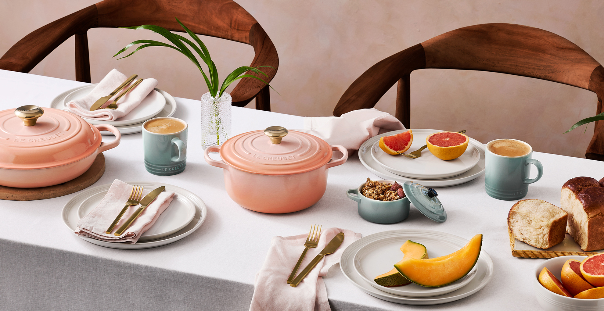 Le Creuset limited edition Peche colour on a dining table