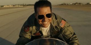 Tom Cruise happy on a motorcycle as Pete “Maverick” Mitchell in Top Gun: Maverick