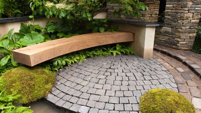 block paving in garden with wooden bench