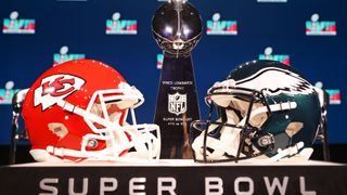 PHOENIX, ARIZONA - FEBRUARY 08: A view of the Vince Lombardi Trophy and the helmets of the Kansas City Chiefs and the Philadelphia Eagles before a press conference for NFL Commissioner Roger Goodell ahead of Super Bowl 2025 on Sunday, February 9