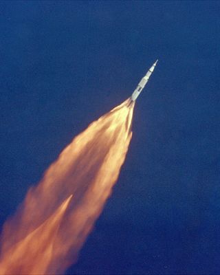 The Apollo 11 Saturn V space vehicle climbs toward orbit on July 16, 1969, bearing astronauts Neil A. Armstrong, Michael Collins and Edwin E. Aldrin, Jr. Armstrong and Aldrin would make history as the first men on the moon.