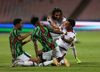 Demarai Gray of Al Ettifaq celebrates with his team-mates after scoring his sides third goal during the Saudi Pro League match between Al Wehda v Al Ettifaq at King Abdul Aziz Stadium on October 28, 2023 in Mecca, Saudi Arabia. (Photo by Abdul Ghani Bashir Issa/MB Media/Getty Images)