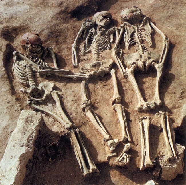 Why did early human societies practice violent human sacrifice?