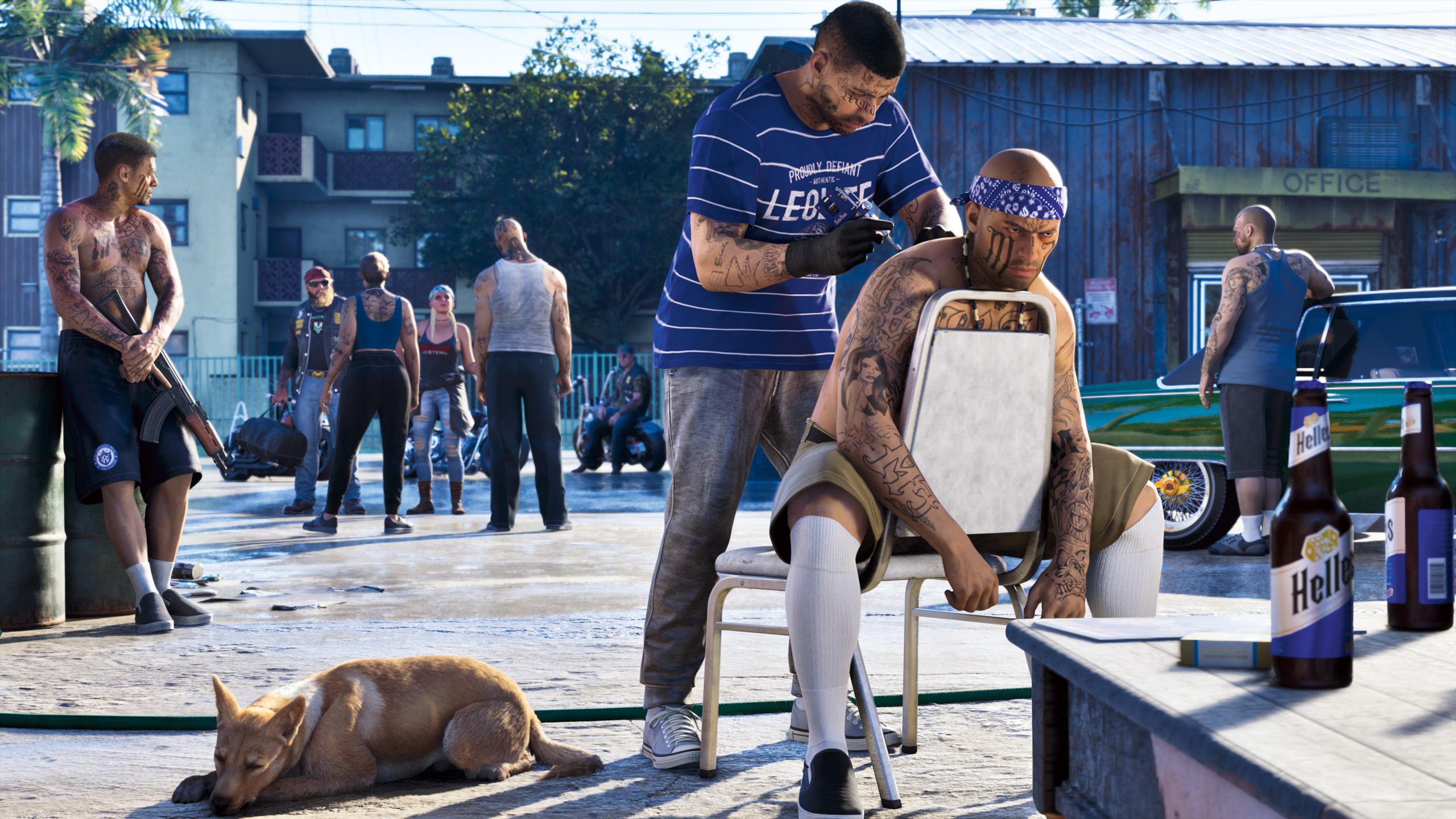 GTA 6 screenshot which shows a local gang in Leonida. A dog basks in the sun while one man gives a tattoo to another.