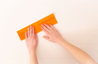 A folded orange piece of paper.