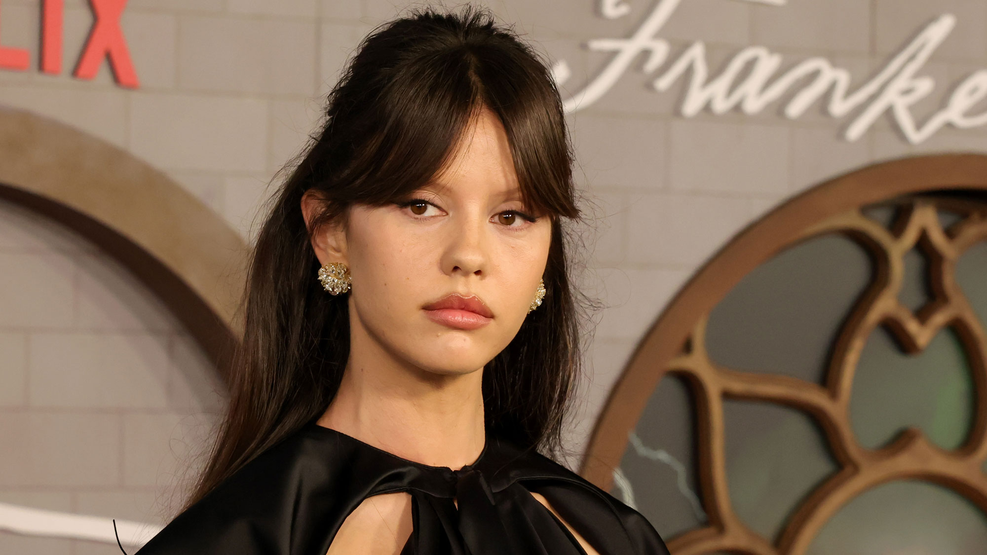 Mia Goth wears a black Dior dress in October 2025