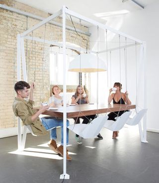 Inject a bit of fun into everyday meetings and mealtimes with this cool swing table design by Christopher Duffy