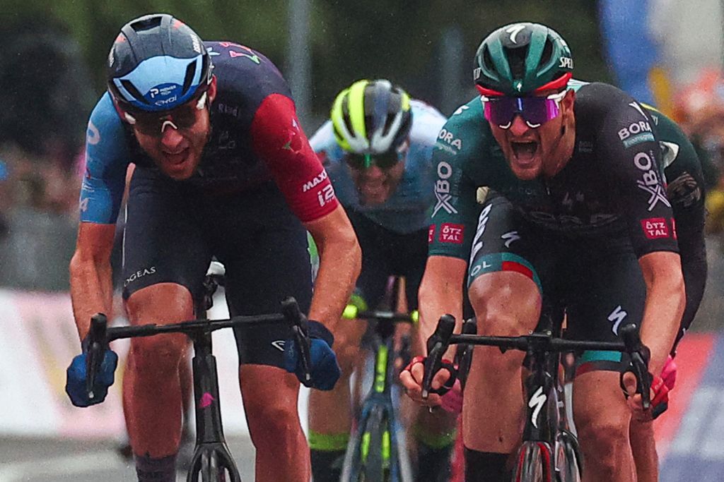 BORA - hansgrohe&#039;s German rider Nico Denz (R) sprints in the last meters to win, ahead of Israel - Premier Tech&#039;s Canadian rider Derek Gee (L)