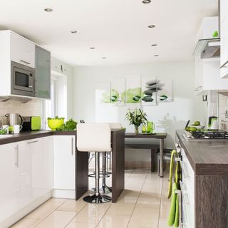 stylish modern kitchen with white wall and oven