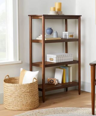 Rattan basket beside wooden shelves