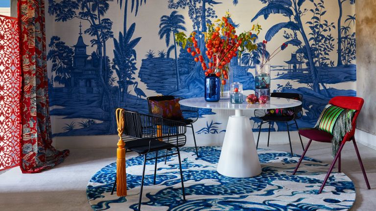 Blue dining room with chinoiserie print wallpaper in blue and white 