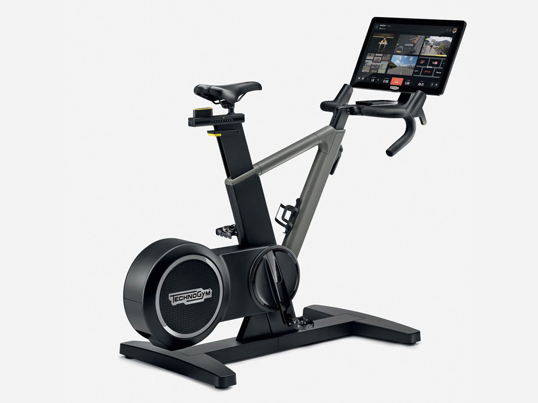 futuristic looking Technogym Ride Smart Bike with a huge 22 inch screen in black and grey