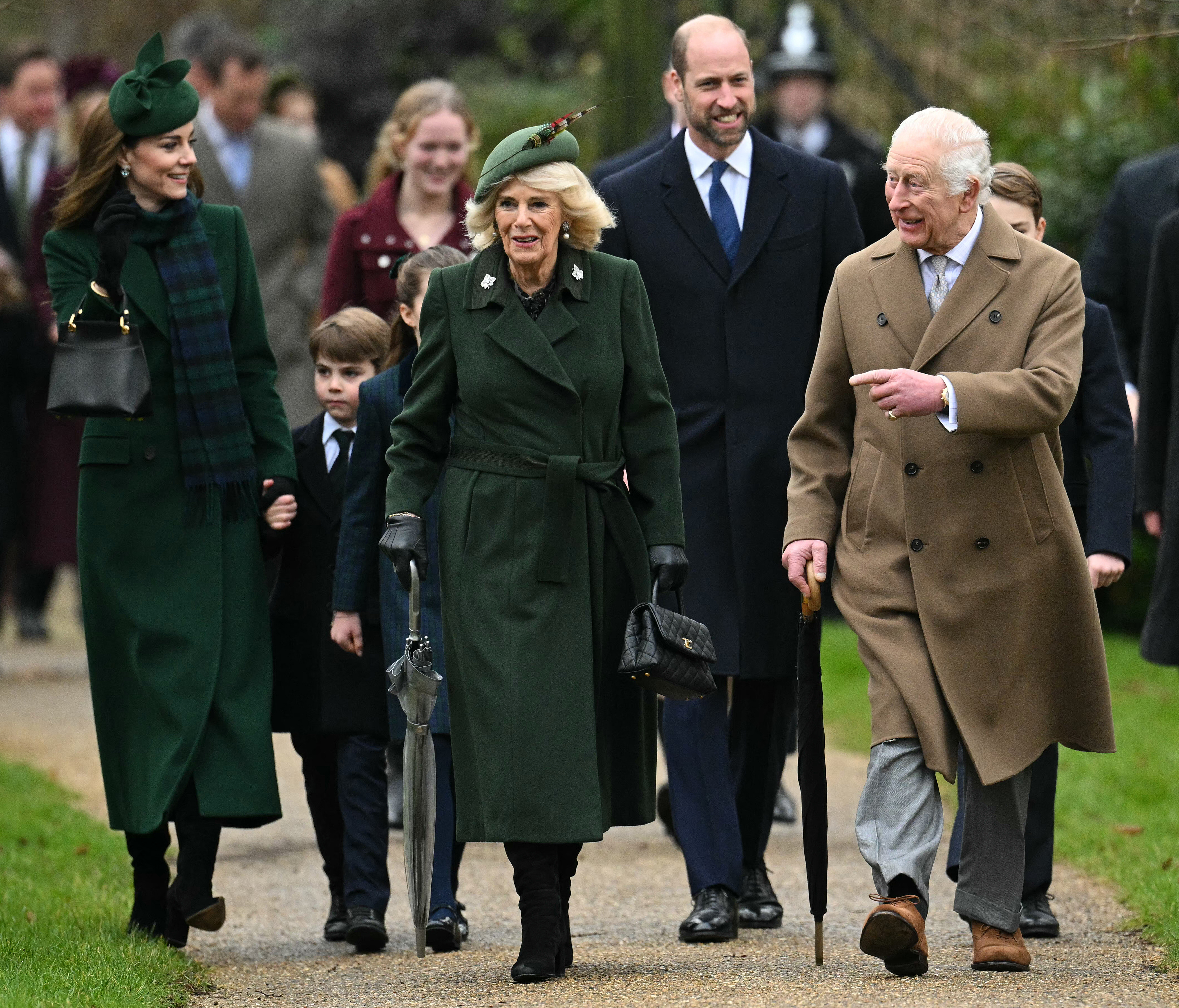 King Charles, Prince William, Queen Camilla, Kate Middleton walking to church on Christmas wearing long coats