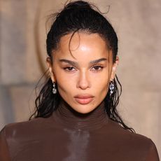 Zo&euml; Kravitz attended the Saint Laurent Fall 2026 show in a chocolate brown turtleneck look from the label