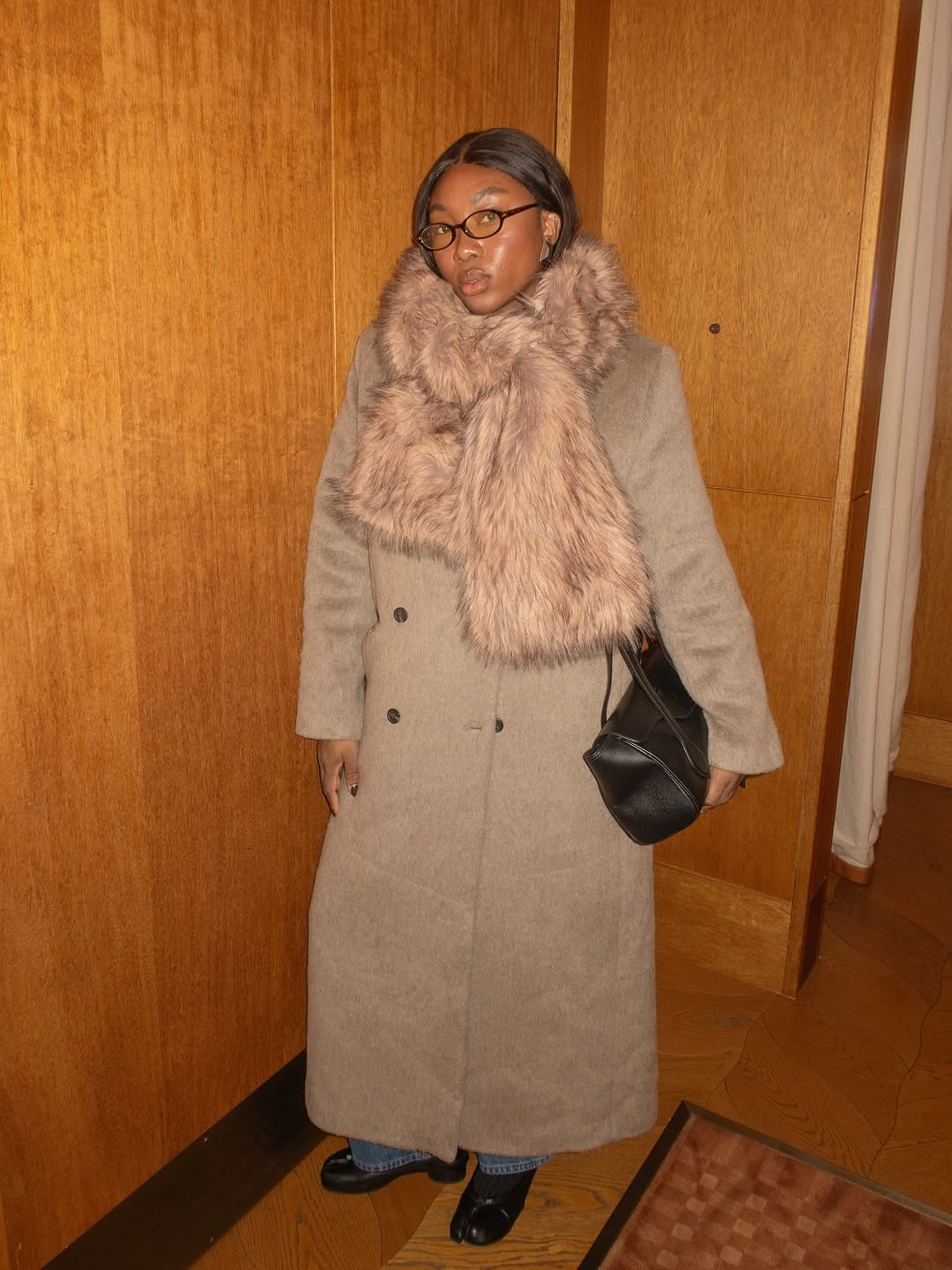 woman wearing chic holiday outfit idea 2025