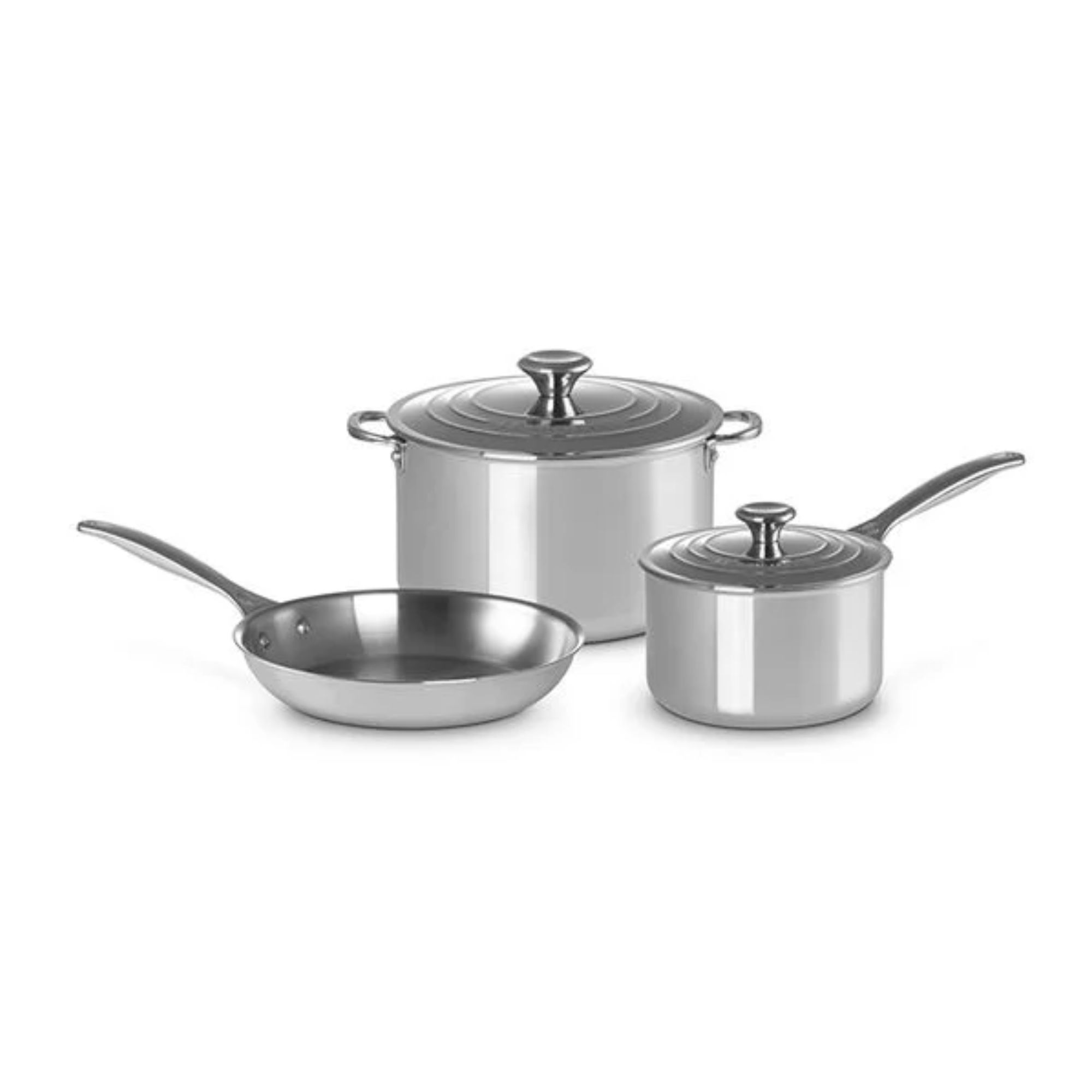 A set of three stainless steel pots, with a frying pan and two sauce pots
