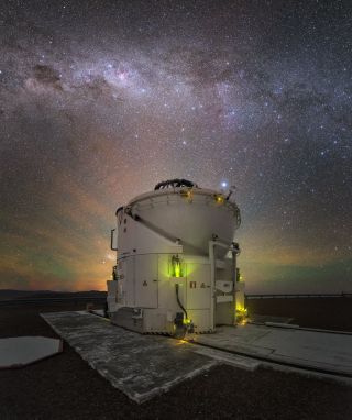 Green and yellow airglow topped with the shimmering core of the Milky Way galaxy provide a beautiful backdrop for a telescope at the Paranal Observatory in Chile in this image by European Southern Observatory (ESO) astrophotographer Yuri Beletsky. The telescope pictured here is one of four small auxiliary telescopes for ESO's Very Large Telescope array.