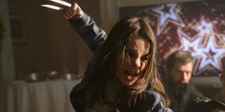 Laura slashing an enemy in Logan
