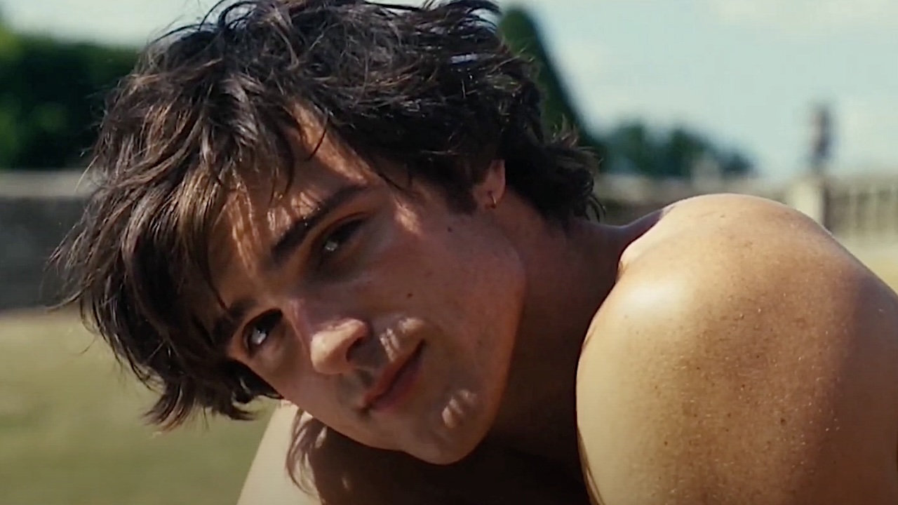 Jacob Elordi looking into camera shirtless in Saltburn