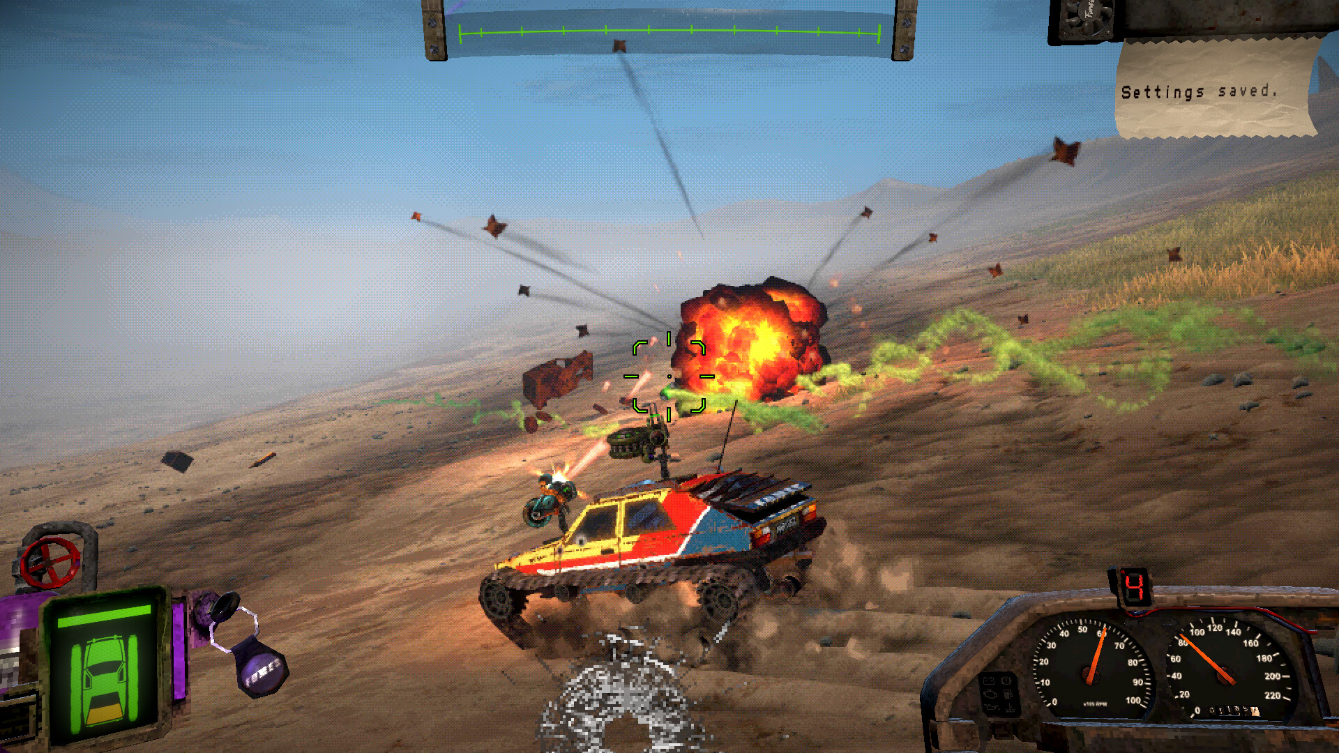 A car with tracks firing machine guns at a rival car that's exploding ahead of them.