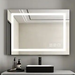 LED wall mirror mounted on bathroom wall