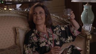Emily Gilmore drinking and smoking a cigarette.