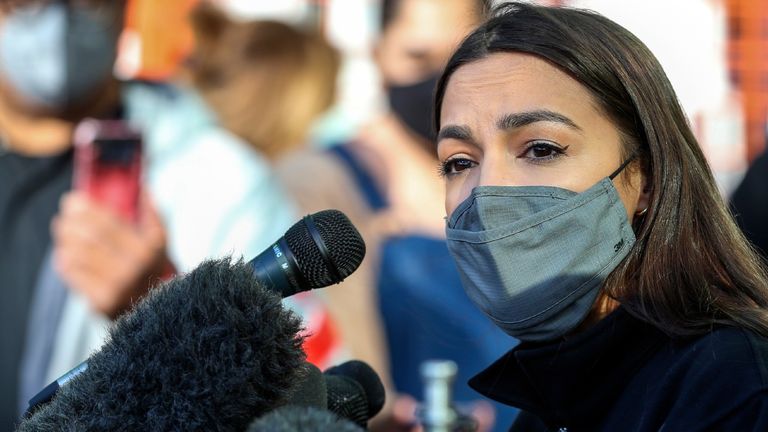 Alexandria Ocasio-Cortez speaks to the media at the Houston Food Bank on February 20, 2021 in Houston, Texas. - The lawmakers address the weather disaster in Texas and helped distribute food at the food bank. 