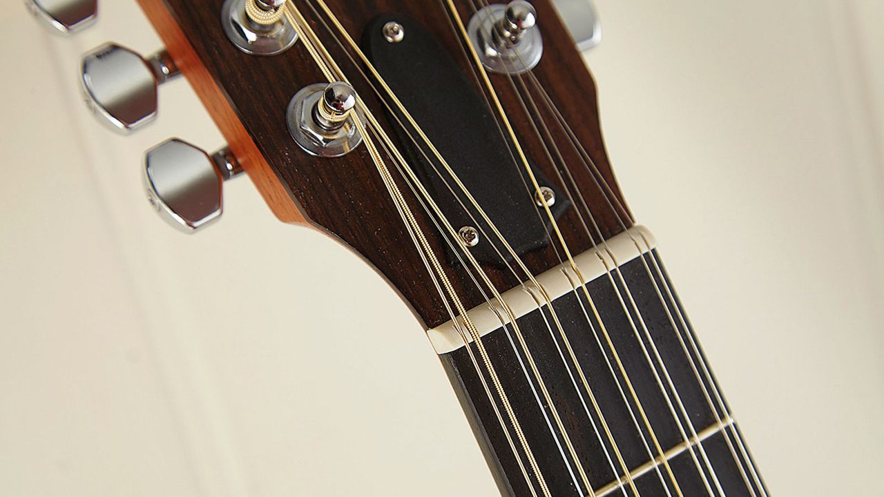 12 strings means 12 tuners and an elongated headstock. Intonation, however, is excellent