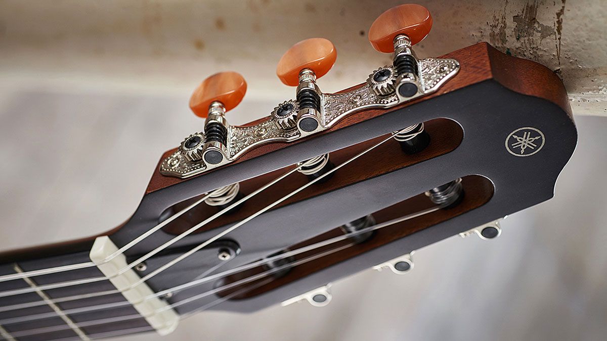 The nylon Silent Guitar packs a classic slotted peghead to go with the classical-style bridge
