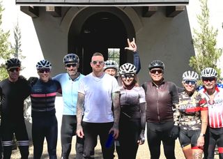 Bradley Wiggins (centre) greets George Hincapie and group of riders at Hotel Domestique on course preview of Gran Fondo Hincapie