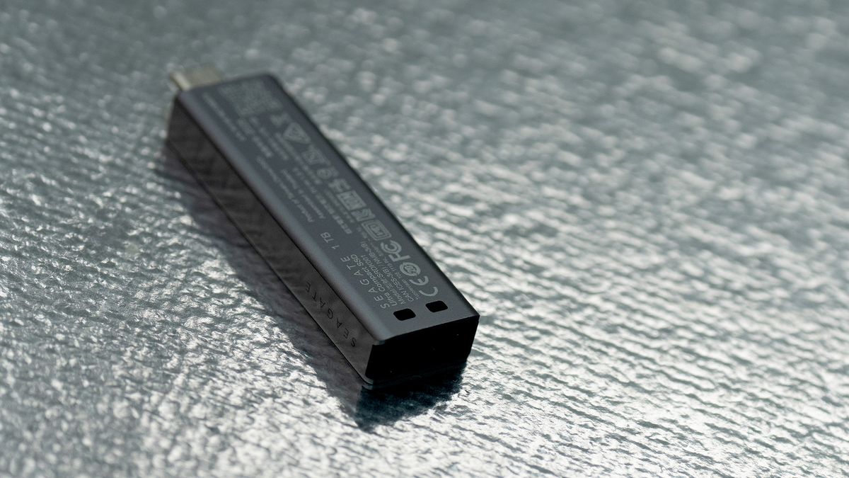 Seagate Ultra Compact SSD on a glass background.