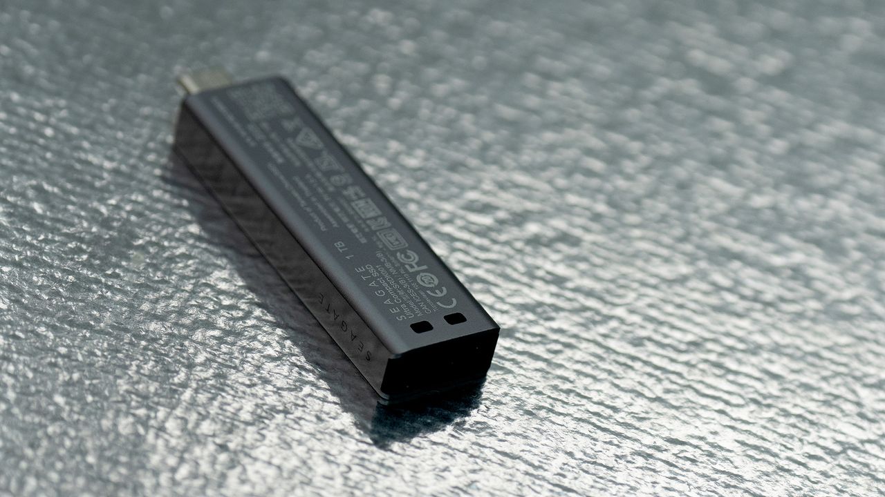 Seagate Ultra Compact SSD on a glass background.