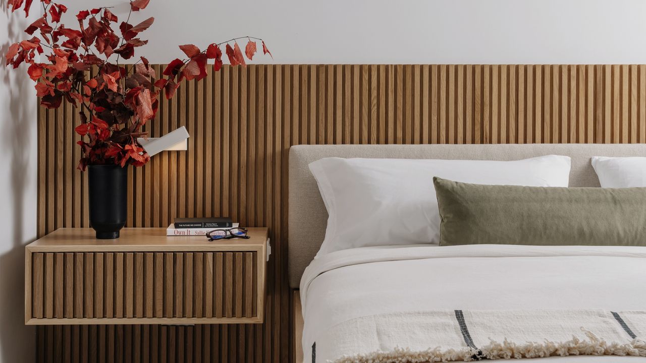 A modern bedroom with elongated headboard