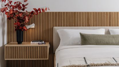A modern bedroom with elongated headboard