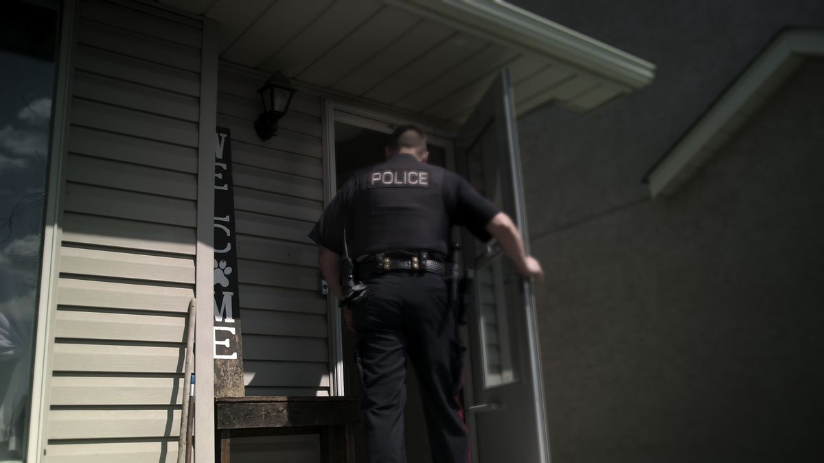 Cop walking into a home in Unsolved Mysteries volume 4