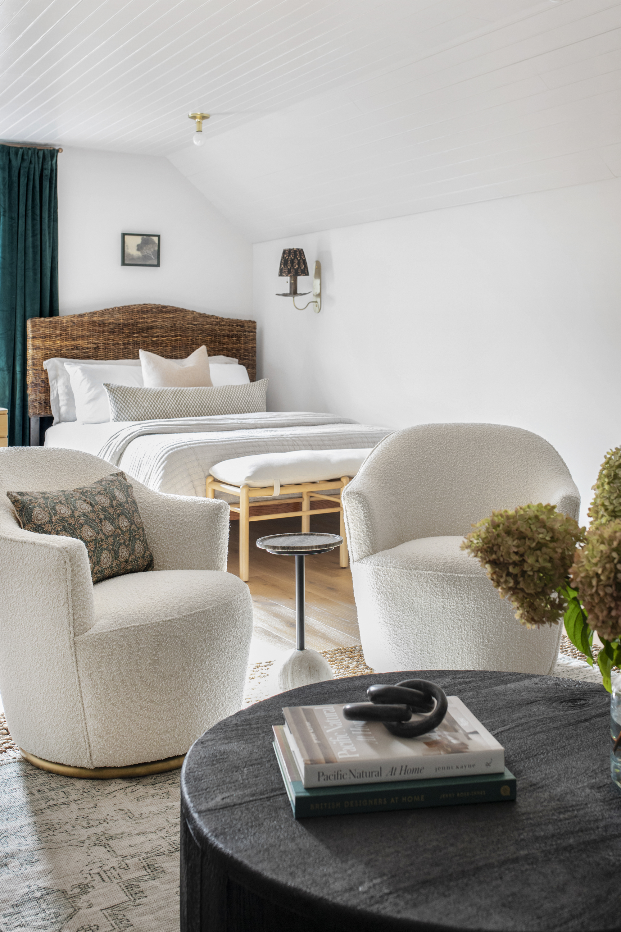 guest room seating area with white swivel chairs