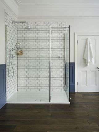 shower storage ideas with corner caddy in white bathroom by Drummonds