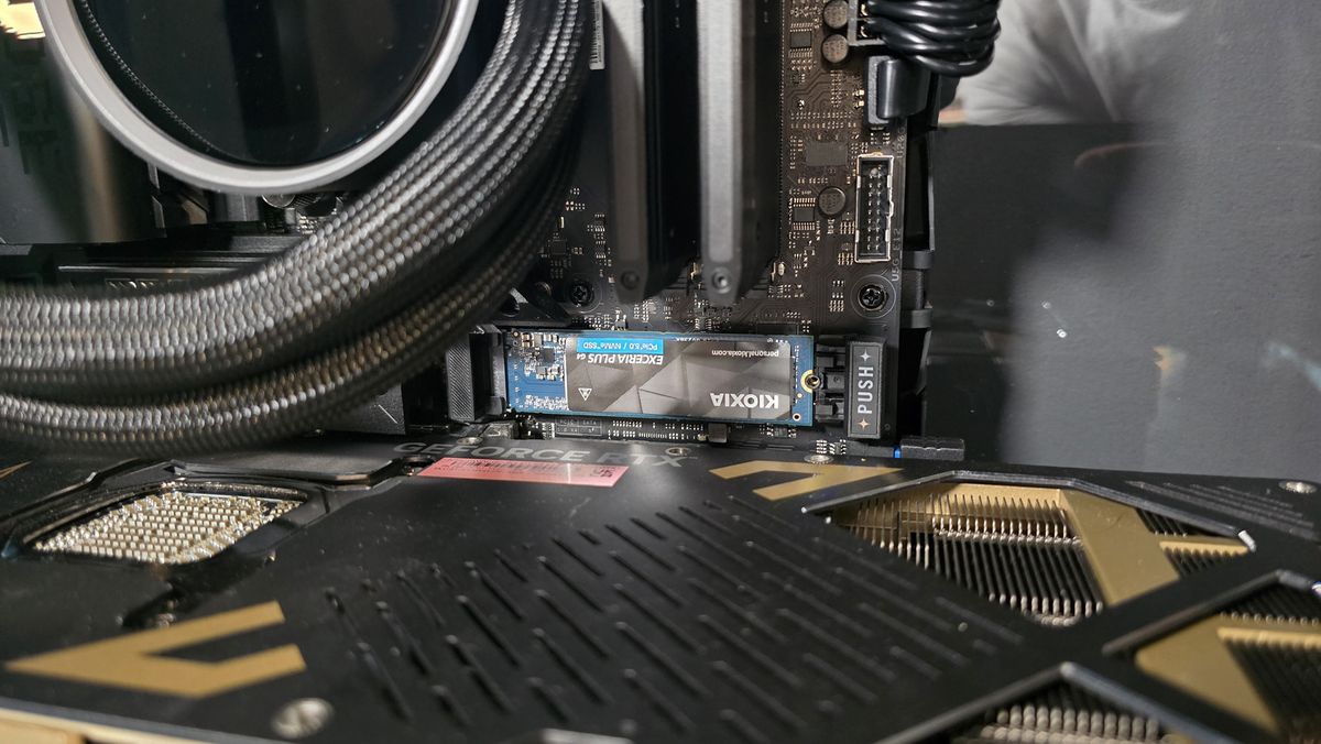 The Kioxia Exceria Plus G4 on a desk, ready to be installed inside a gaming PC.