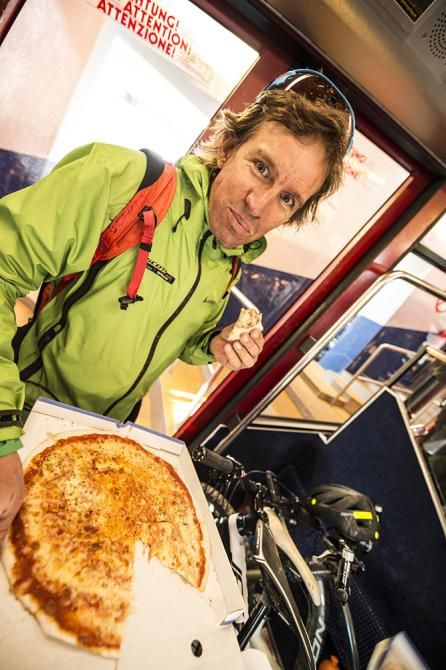 Thomas Frischknecht enjoys some pizza