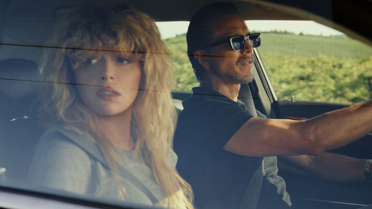 Charlie Cale looks concerned as she looks out of a car&#039;s passenger-side window in Peacock&#039;s Poker Face