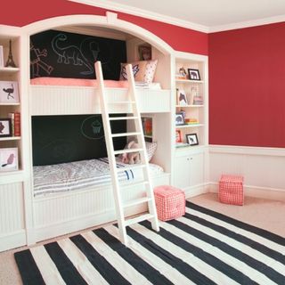 bedroom with red wall and carpet flooring with ladder