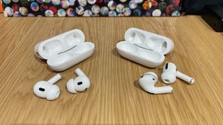 AirPods Pro and AirPods Pro 2 with their charging cases side by side