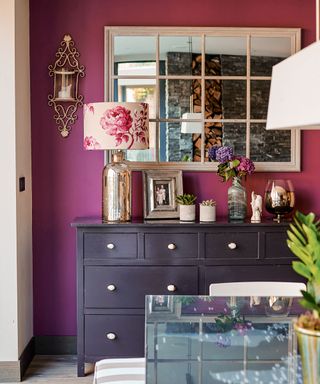 dining area with purple and glass table and brown shelf