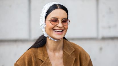 A fashion week attendee wearing brown blusher