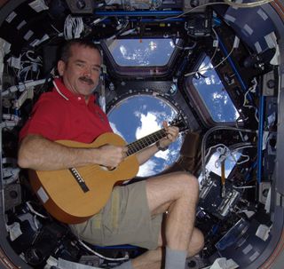 Canadian astronaut Chris Hadfield plays Christmas carols in space.