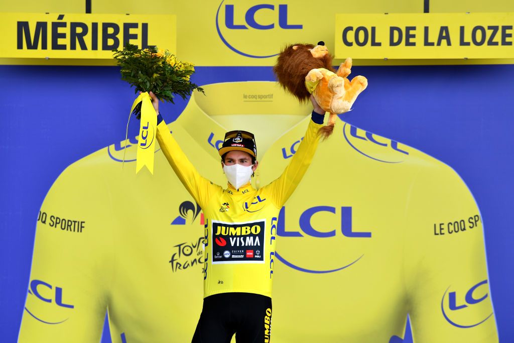 MERIBEL FRANCE SEPTEMBER 16 Podium Primoz Roglic of Slovenia and Team Jumbo Visma Yellow Leader Jersey Mascot Flowers Mask Covid safety measures during the 107th Tour de France 2020 Stage 17 a 170km stage from Grenoble to Mribel Col de la Loze 2304m TDF2020 LeTour on September 16 2020 in Mribel France Photo by Stuart FranklinGetty Images